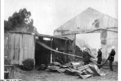 1912-Firemen-training-hoses-on-large-shed